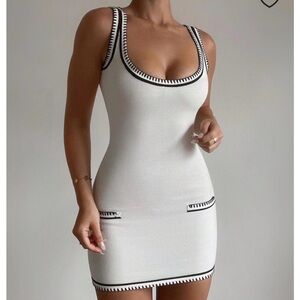 Chic White Sleeveless Mini Dress with Black Trim